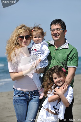 Image of happy young family have fun on beach