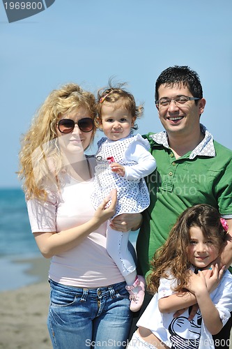 Image of happy young family have fun on beach