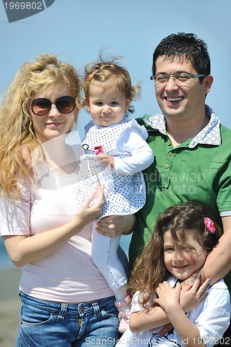 Image of happy young family have fun on beach