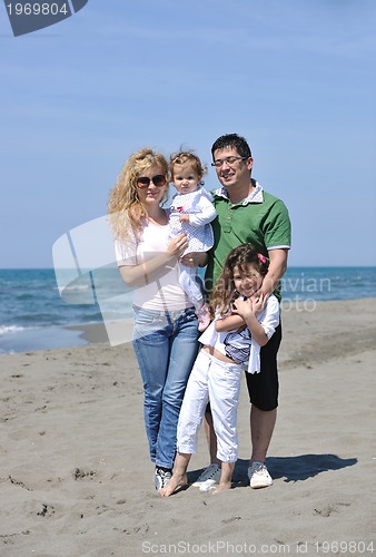 Image of happy young family have fun on beach