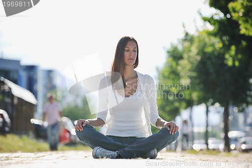 Image of yoga at sunny street