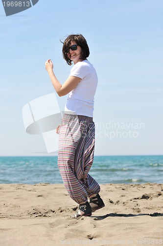 Image of young woman relax  on beach