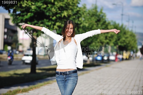 Image of young woman havefun at street 