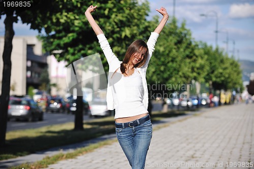 Image of young woman havefun at street 