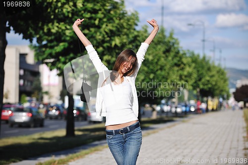 Image of young woman havefun at street 