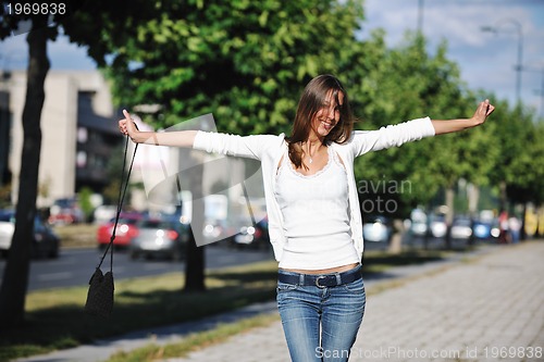 Image of young woman havefun at street 