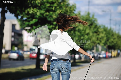 Image of young woman havefun at street 
