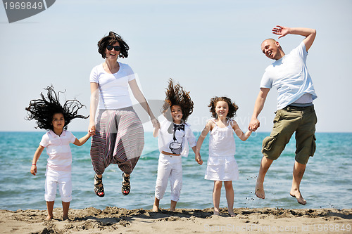 Image of happy young family have fun on beach