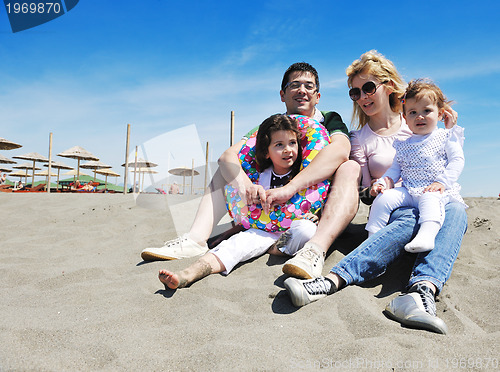 Image of happy young family have fun on beach