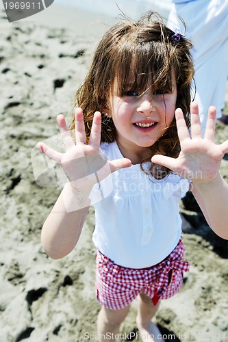 Image of little female  child portrait on the beach