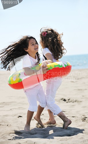 Image of happy young  people group have fun on beach