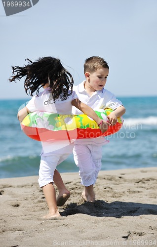 Image of happy young  people group have fun on beach
