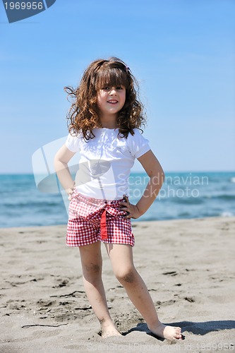 Image of little female  child portrait on the beach