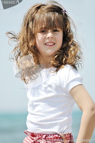 Image of little female  child portrait on the beach