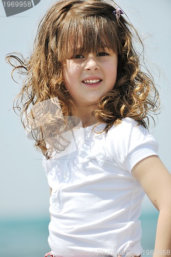 Image of little female  child portrait on the beach