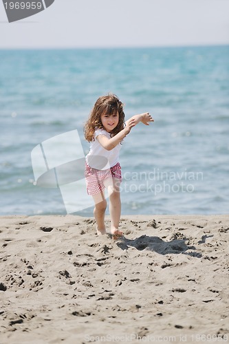 Image of little female  child portrait on the beach