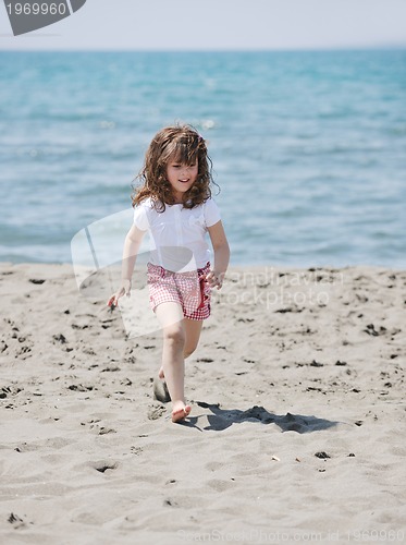 Image of little female  child portrait on the beach