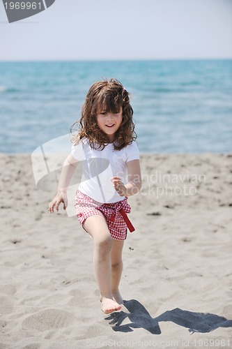 Image of little female  child portrait on the beach