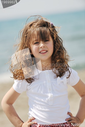 Image of little female  child portrait on the beach