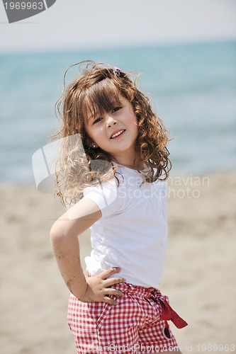 Image of little female  child portrait on the beach