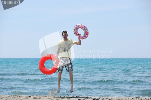 Image of man relax on beach