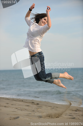Image of happy young couple have fun on beach