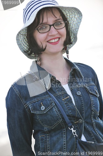 Image of young woman enjoy on beach