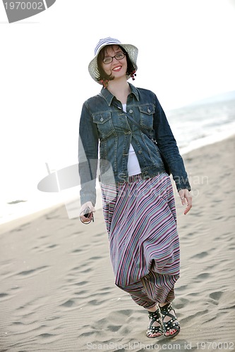 Image of young woman relax  on beach