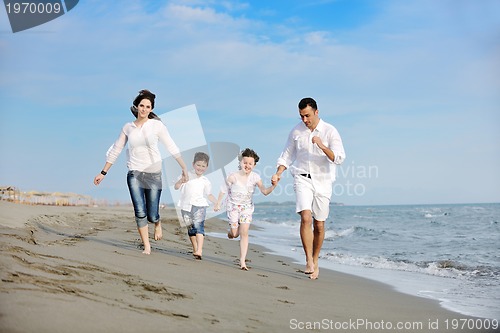 Image of happy young family have fun on beach