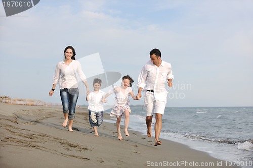 Image of happy young family have fun on beach