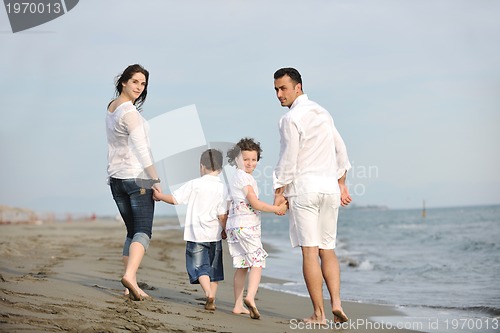 Image of happy young family have fun on beach