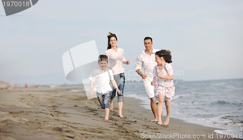 Image of happy young family have fun on beach