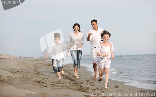 Image of happy young family have fun on beach