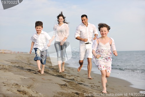 Image of happy young family have fun on beach