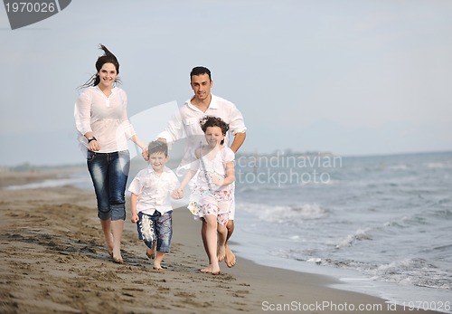 Image of happy young family have fun on beach