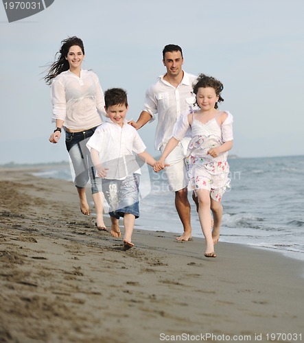 Image of happy young family have fun on beach