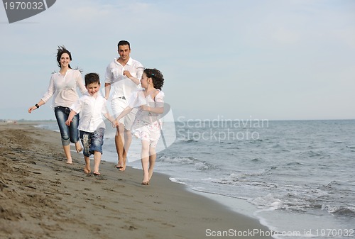 Image of happy young family have fun on beach