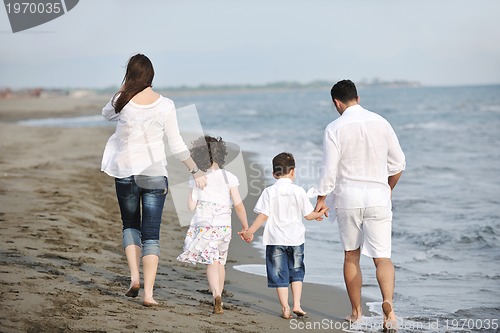 Image of happy young family have fun on beach