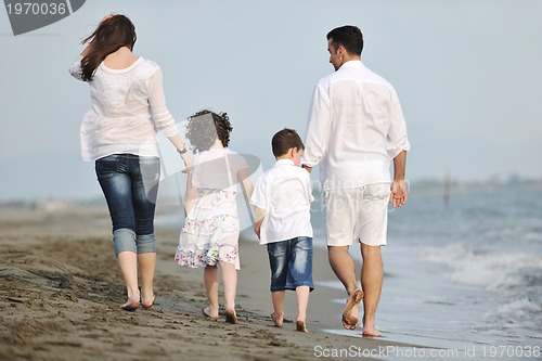 Image of happy young family have fun on beach