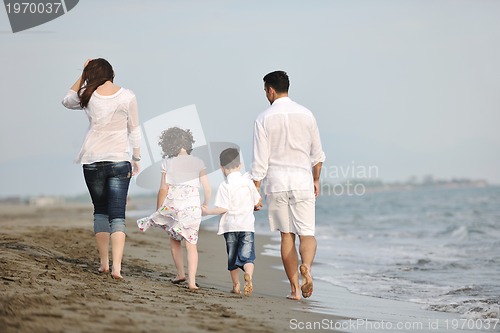 Image of happy young family have fun on beach