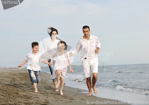 Image of happy young family have fun on beach