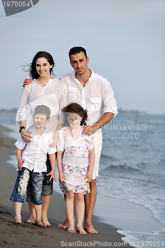 Image of happy young family have fun on beach