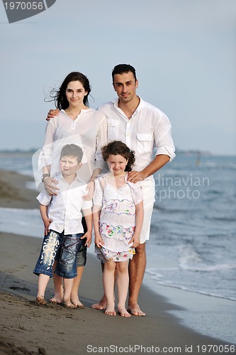 Image of happy young family have fun on beach