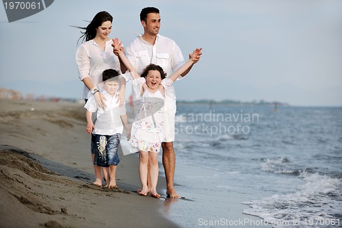 Image of happy young family have fun on beach