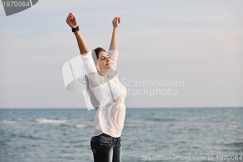 Image of young woman enjoy on beach