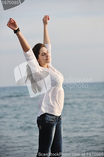 Image of young woman enjoy on beach