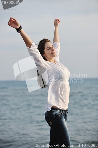 Image of young woman enjoy on beach