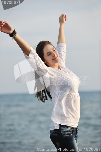 Image of young woman enjoy on beach