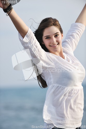 Image of young woman enjoy on beach