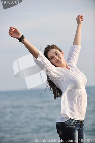 Image of young woman enjoy on beach